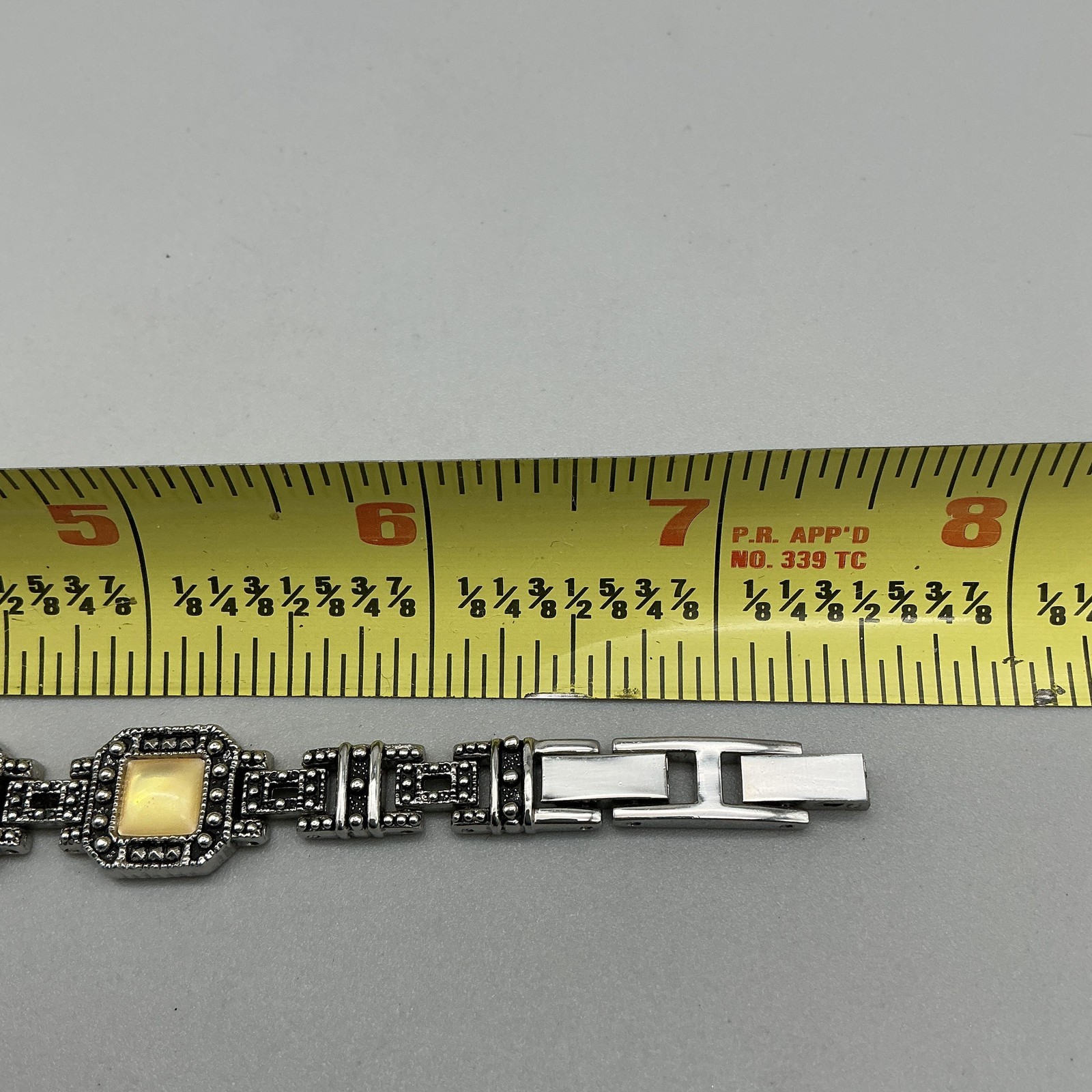 Express Womens Watch 17mm Marcasite Silver Tone Yellow Inlay New Battery 7.25″