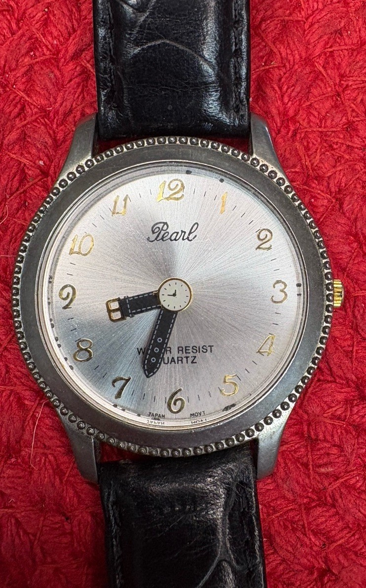 Vintage “Pearl” brand Watch with a Silver-Colored Face, Black Leather Strap