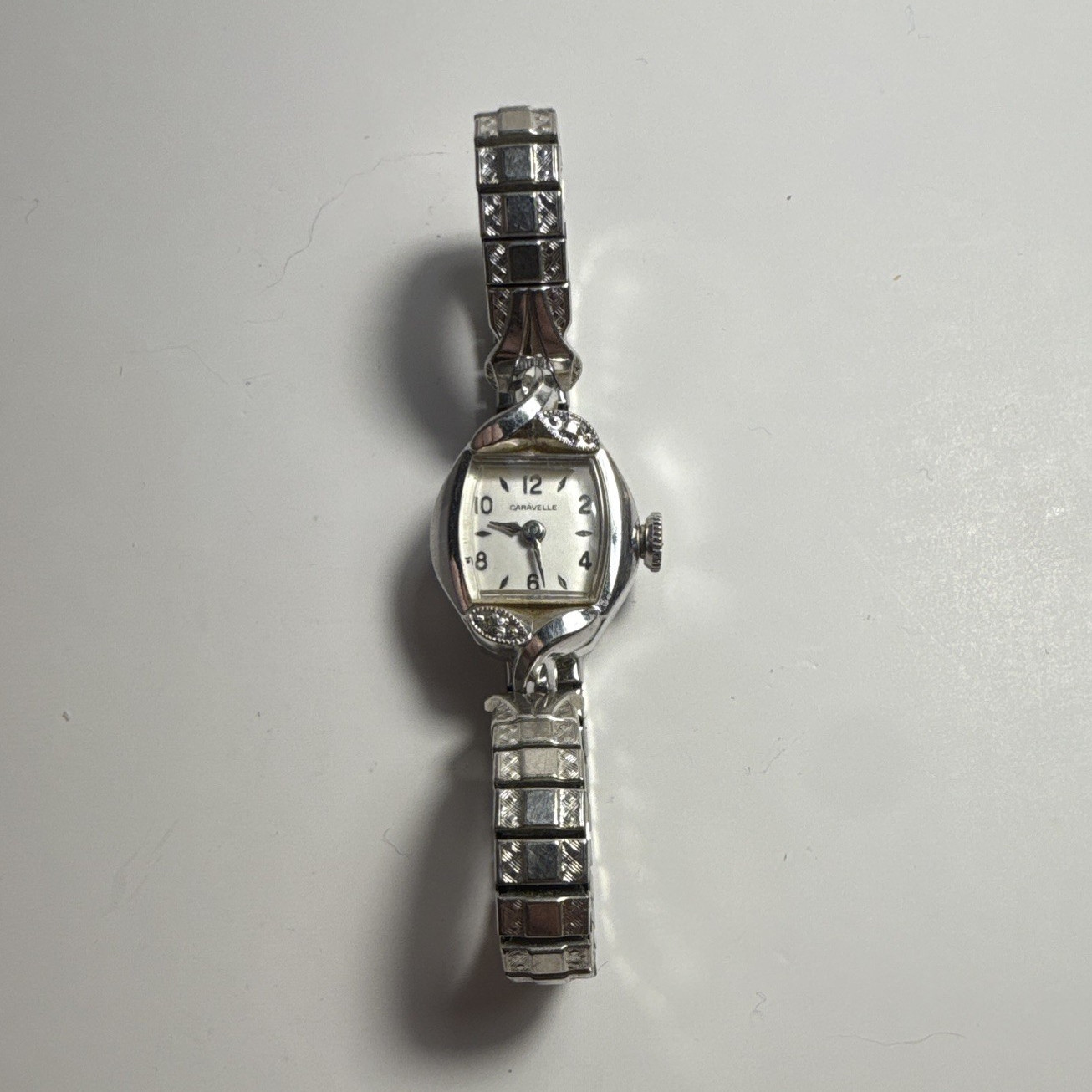 Caravelle Women’s Dress Analog White Dial Arabic Cushion SS Silver Bracelet