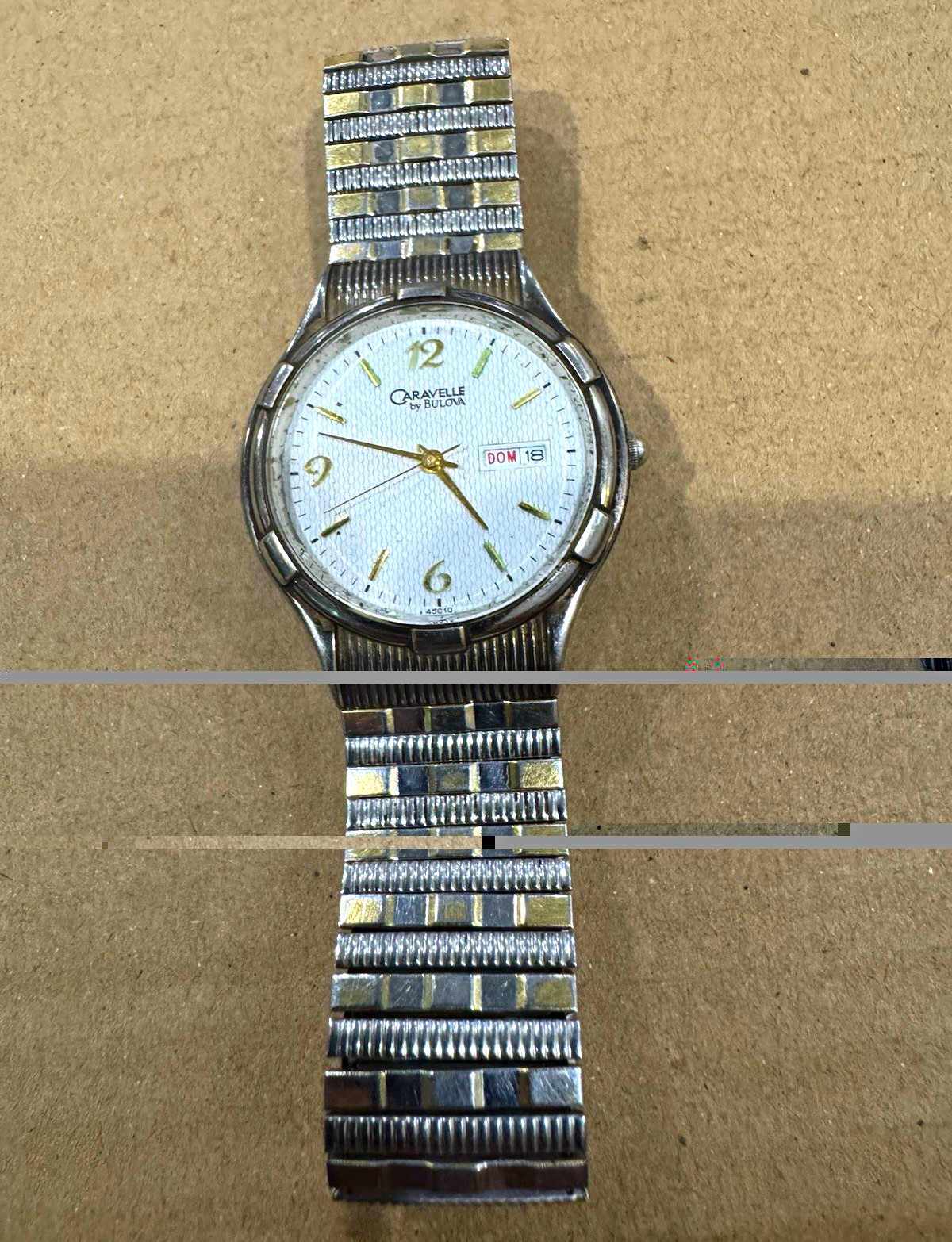 Caravelle by Bulova Quartz Analog Day/Date White Dial SS Bracelet 35mm case