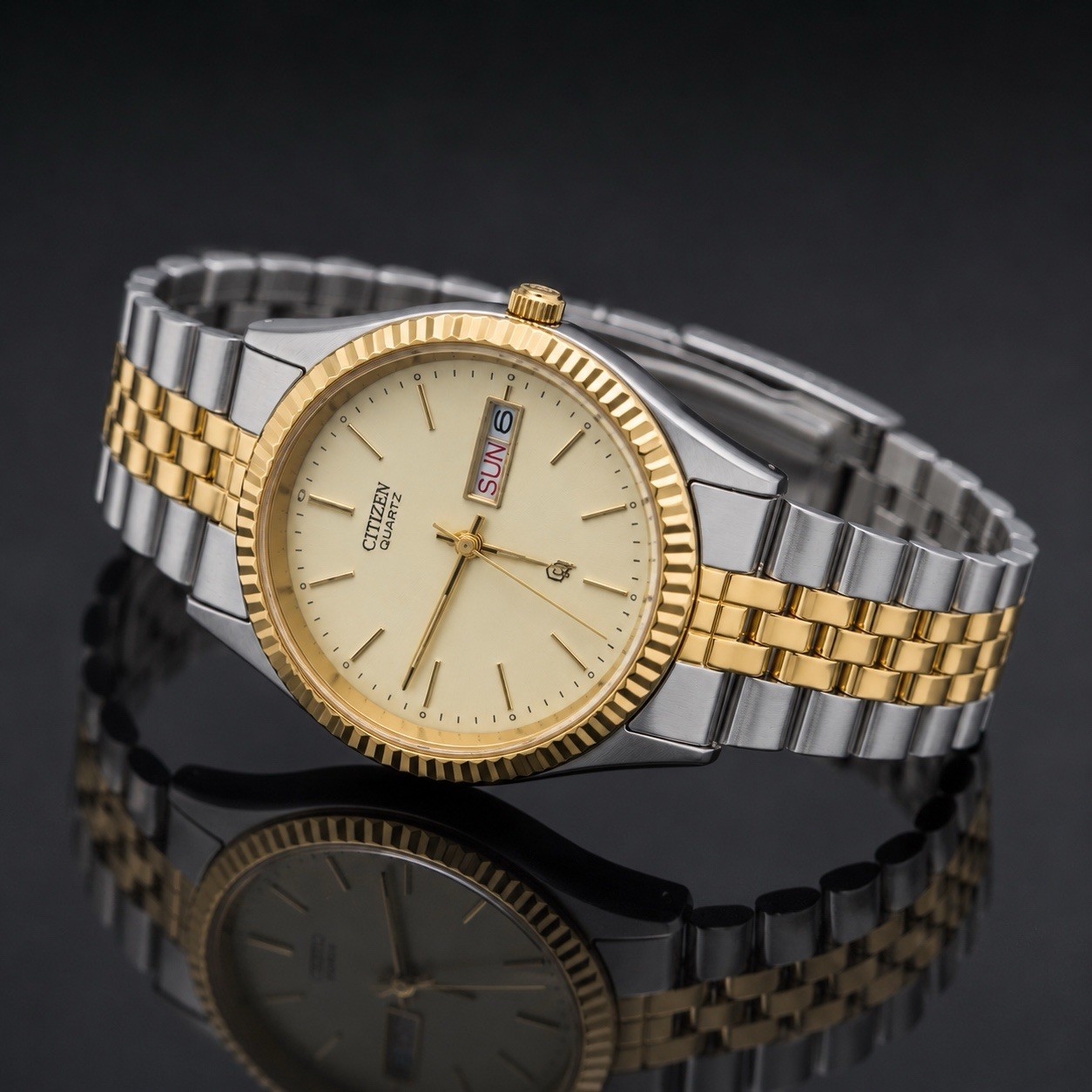 Citizen Quartz Men’s Two-Tone Stainless Bracelet Gold Dial Day/Date Watch.