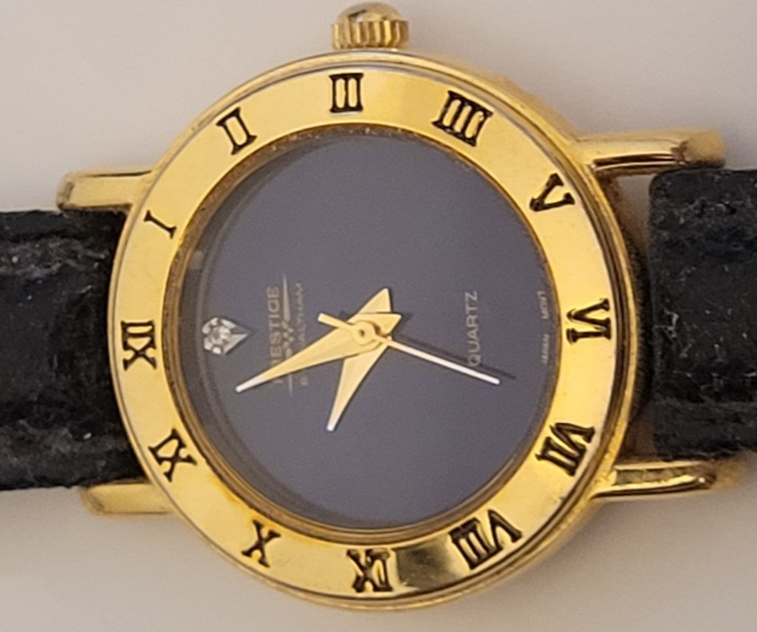 PRESTIGE by WALTHAM QUARTZ WATCH. DIAMOND DIAL WITH GOLD TONE
