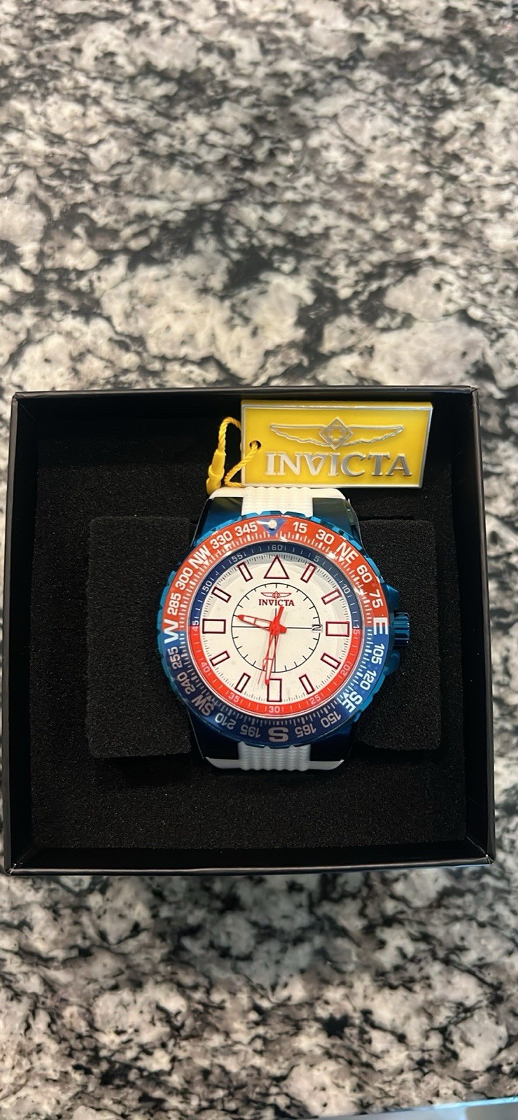 Invicta Aviator Men’s Quartz Wristwatch Blue/Red Compass Bezel White Strap