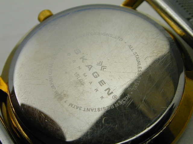 SKAGEN TWO TONE T MADE IN DENMARK RUNS GREAT, CRYSTAL FLAWED AS PICTURED.