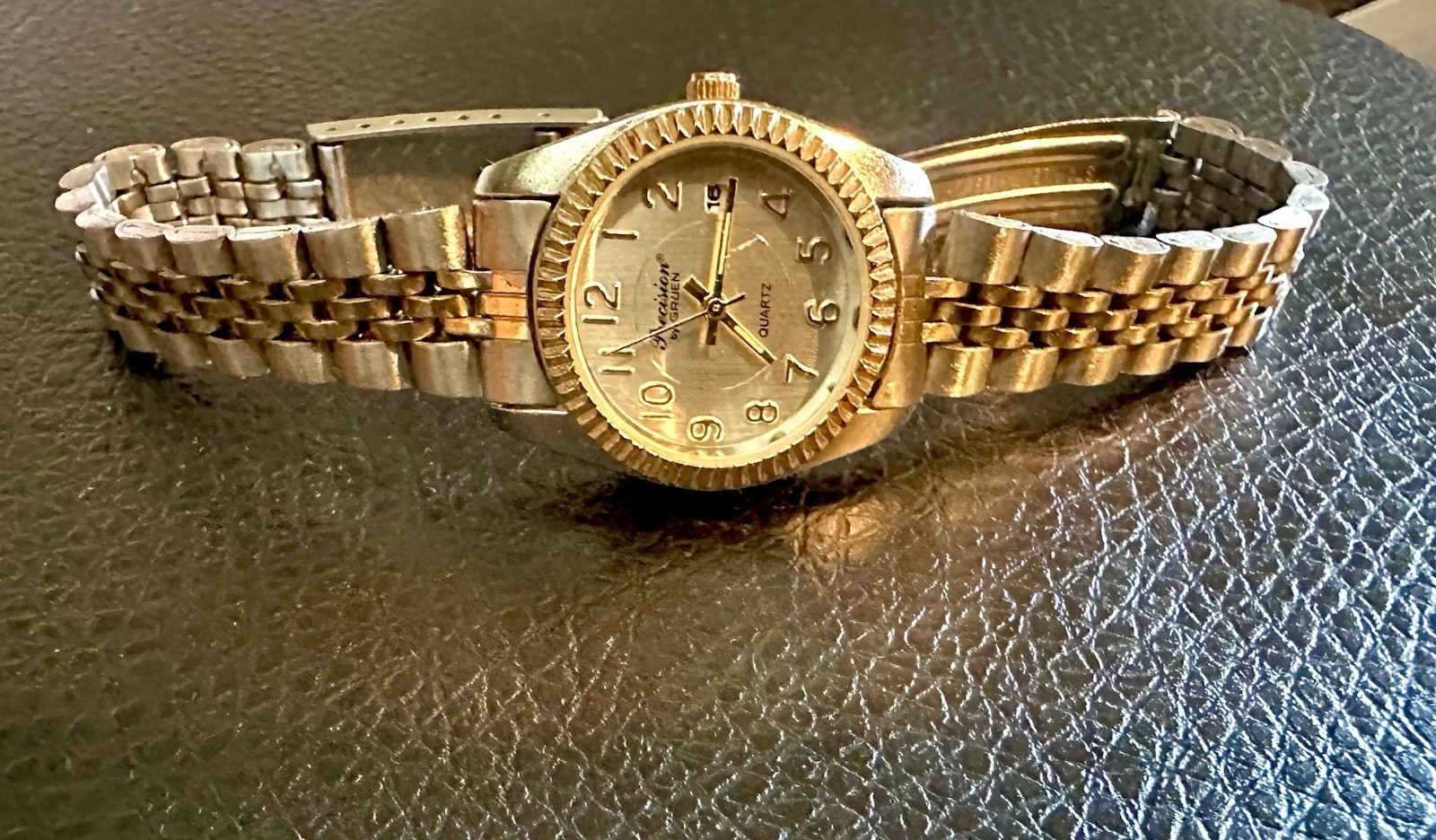 vintage Precision by Gruen quartz watch featuring a two-tone gold and silve