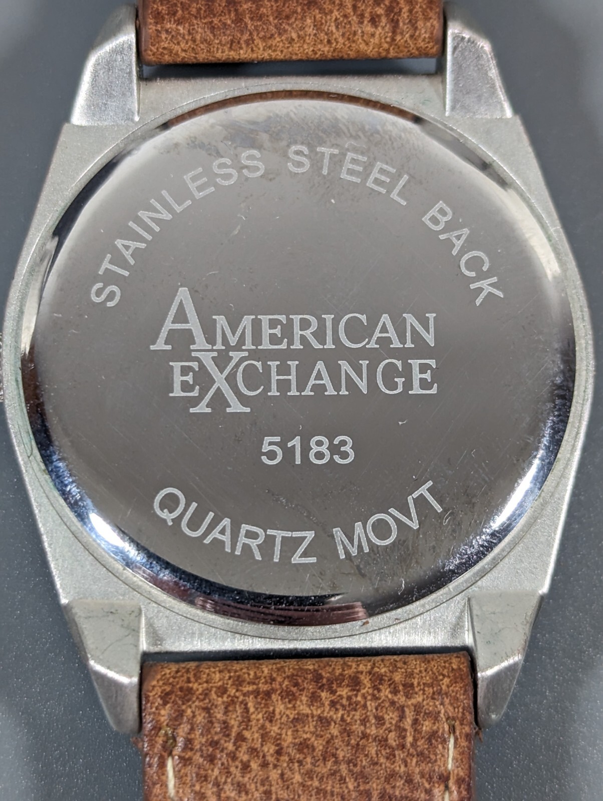 American Exchange Black Dial Round Silver Tone Case Brown Faux Leather Bnd Watch