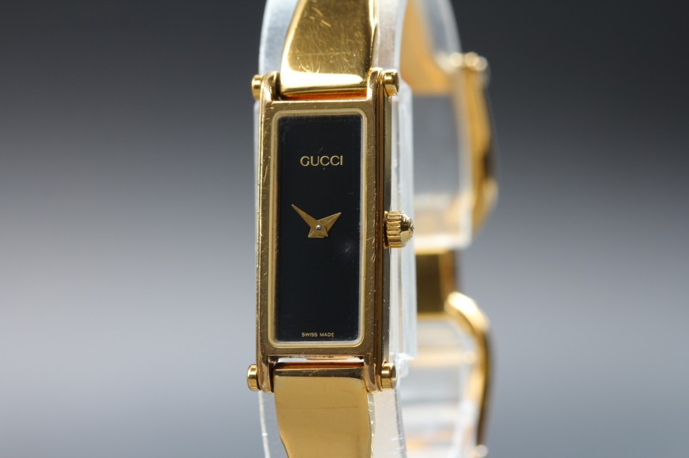 GUCCI 1500 Black Dial Rectangular Gold Bangle Quartz 12mm Ladies Watch