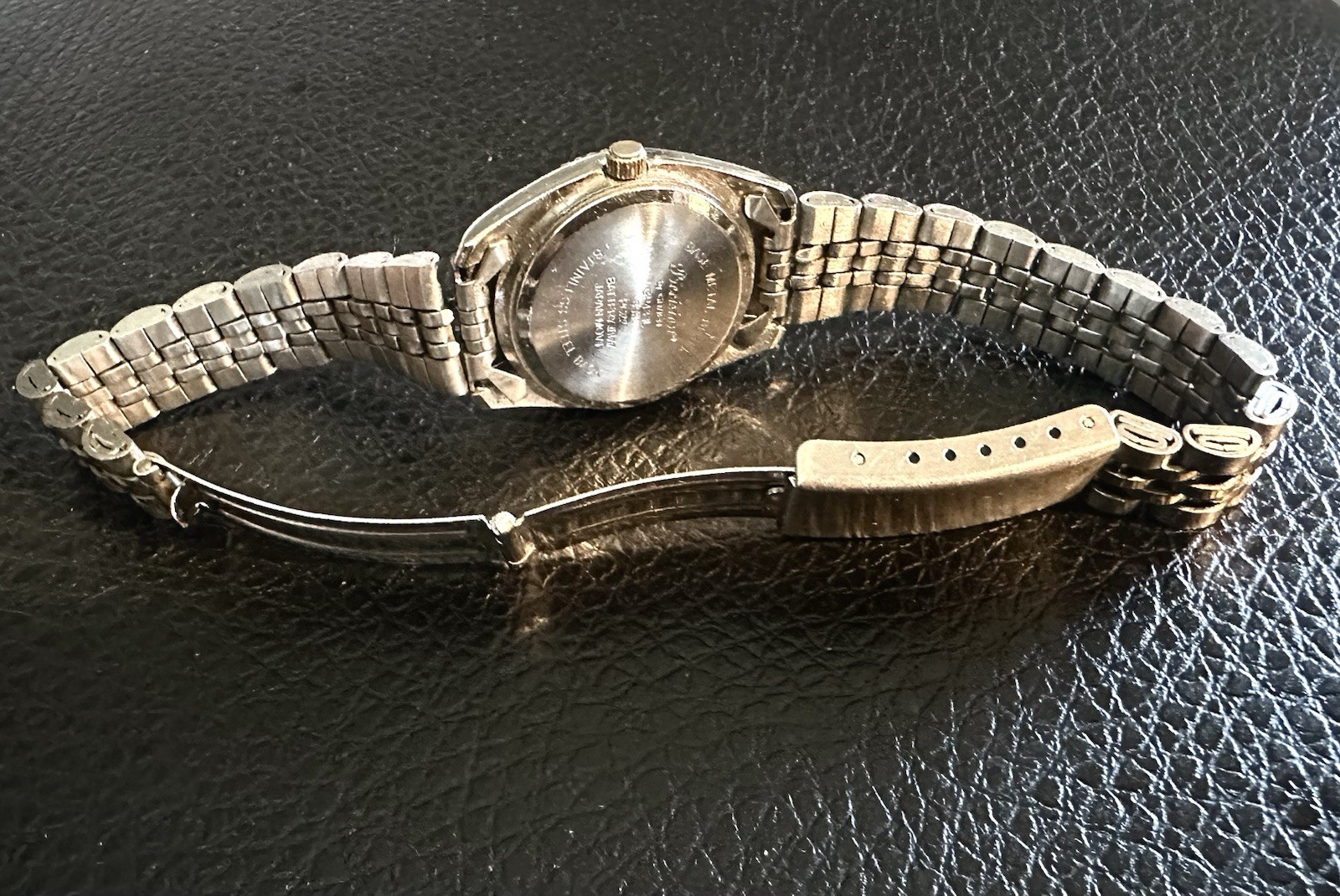 vintage Precision by Gruen quartz watch featuring a two-tone gold and silve