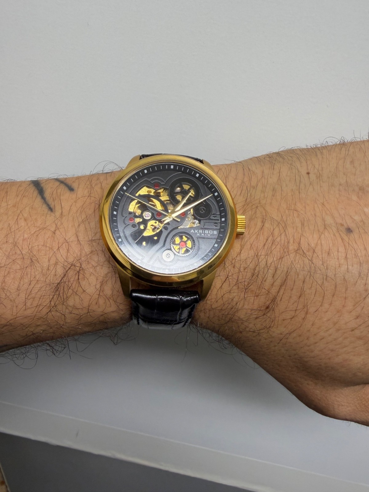 Akribos XXiv Mechanical Skeleton Goldtone Black Leather Band Mens Watch