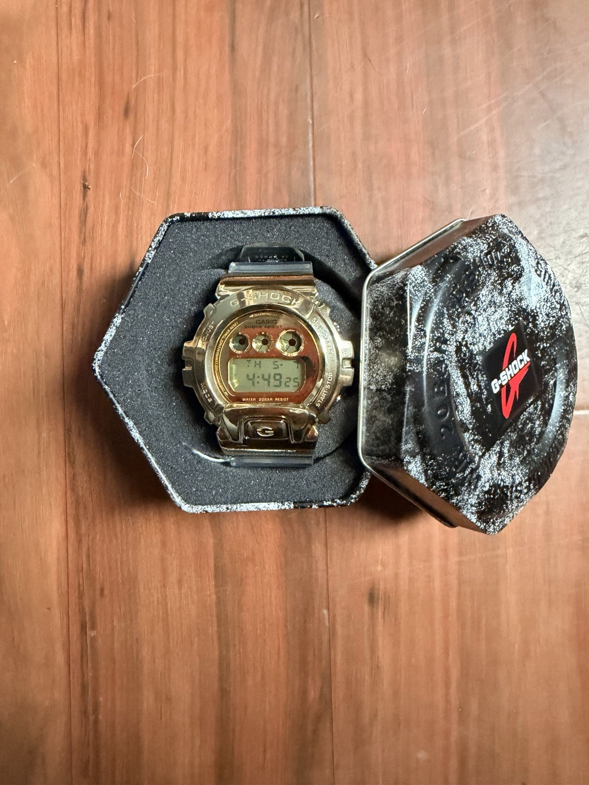 Casio G-SHOCK Digital Quartz Gold Tone w/ Clear Resin Band 200m Tin Box
