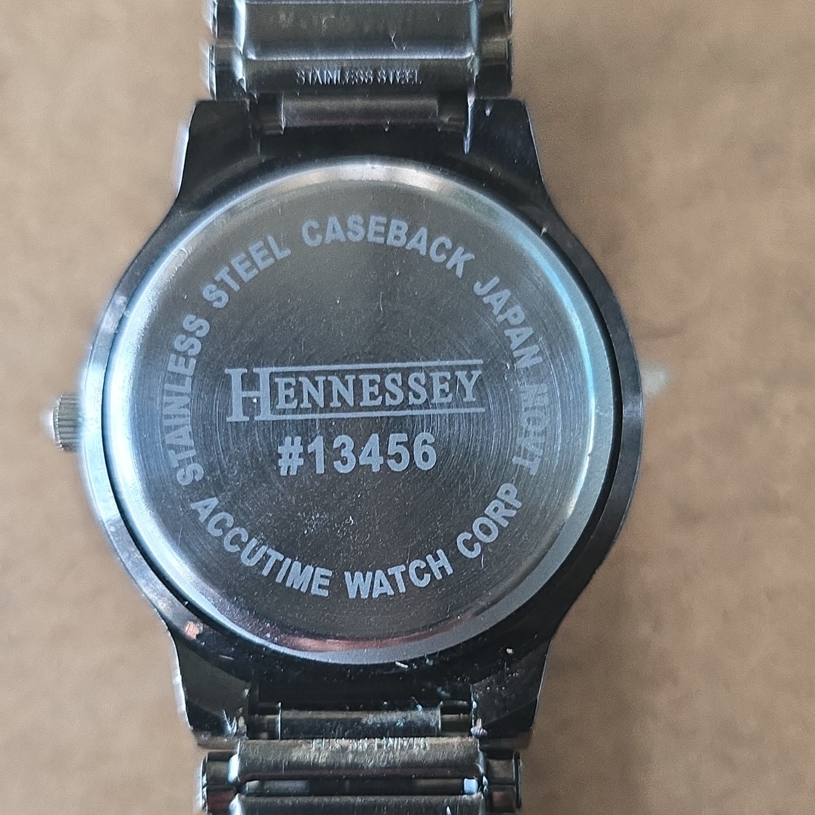 Hennessey Quartz Analog Wristwatch Black Dial Arabic Numerals Silver Bracelet