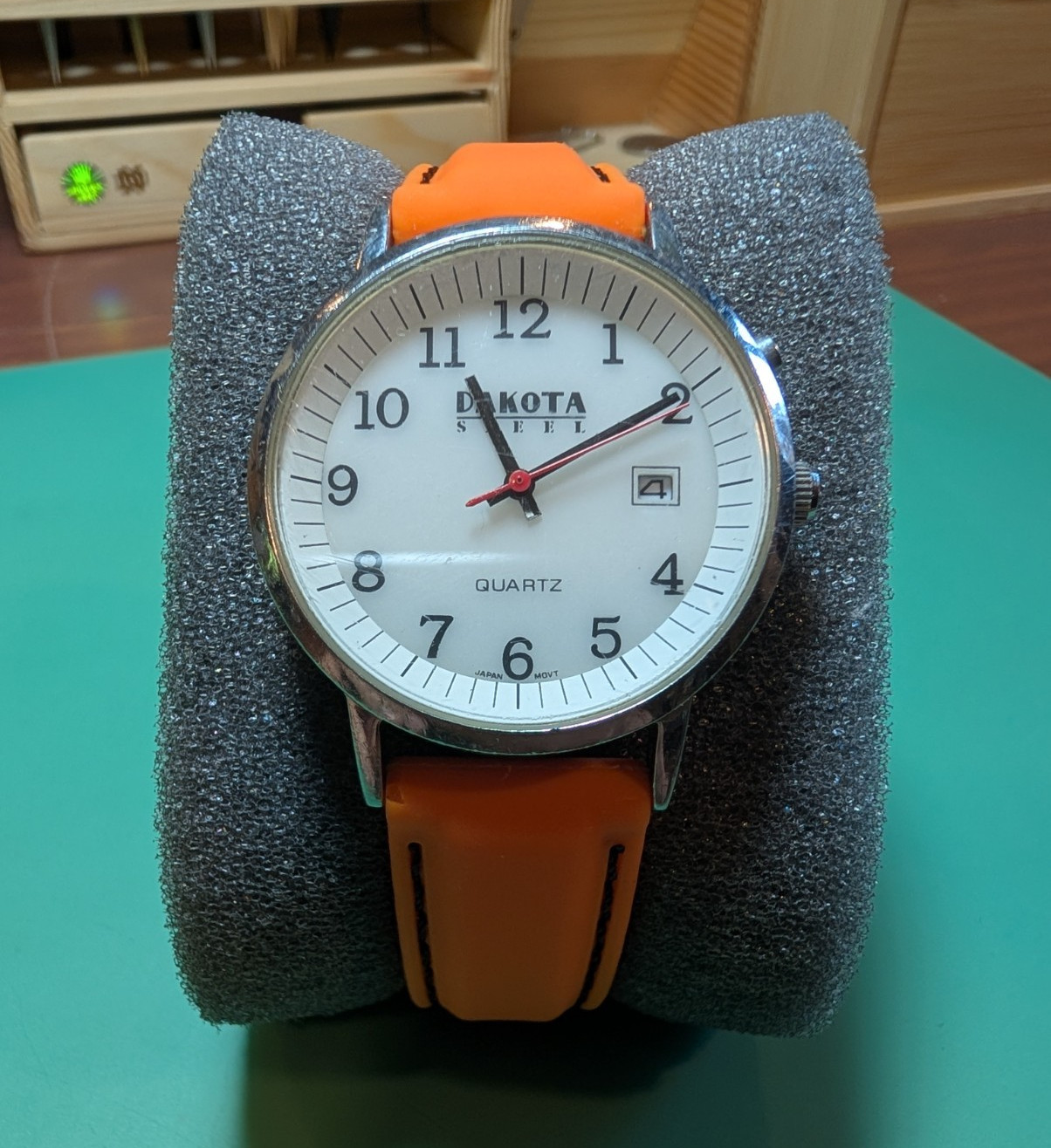 Dakota Moon-Glow Quartz Analog Watch Date Luminous White Dial Orange Strap