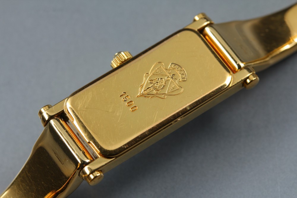 GUCCI 1500 Black Dial Rectangular Gold Bangle Quartz 12mm Ladies Watch