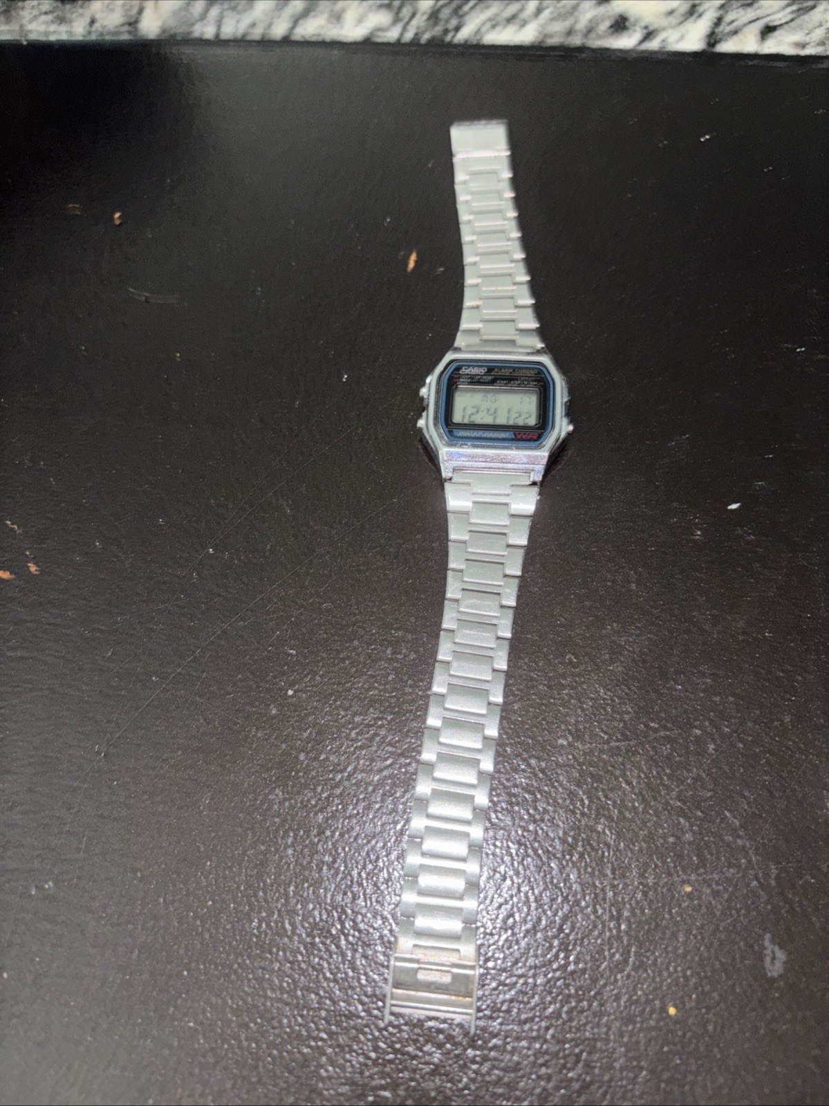 Vintage Casio A158WA-1 digital watch features a classic square face