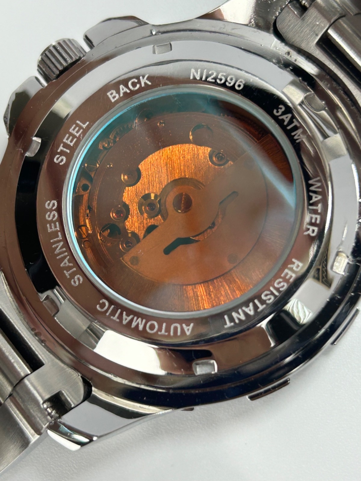 Nibosi NI2596 Mens Automatic 42MM Day/Date Silver Tone Blue Dial Exhibition Back