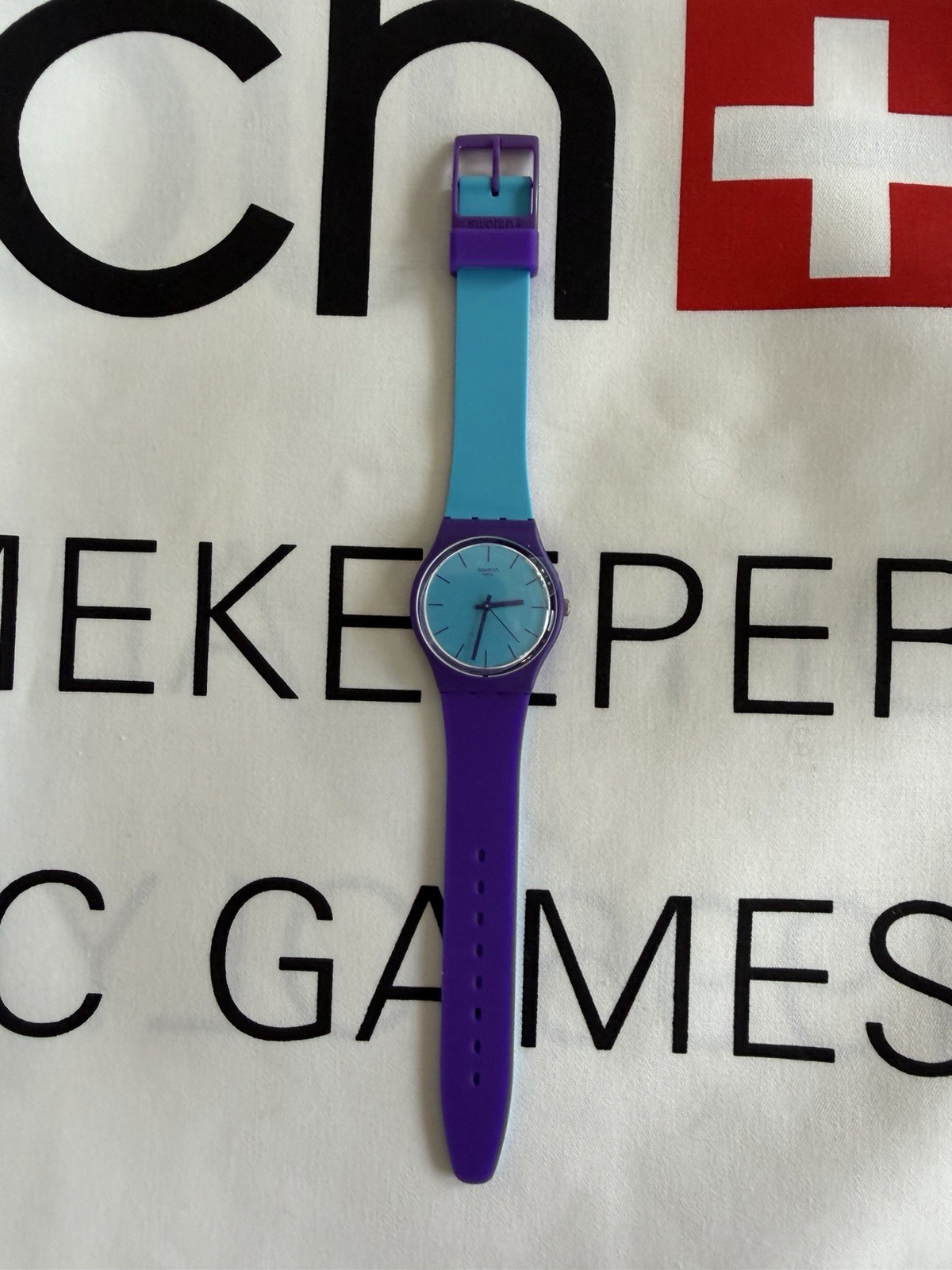 Swatch GV128 Polymer Watch – Turquoise Dial& Purple Strap – New in Box