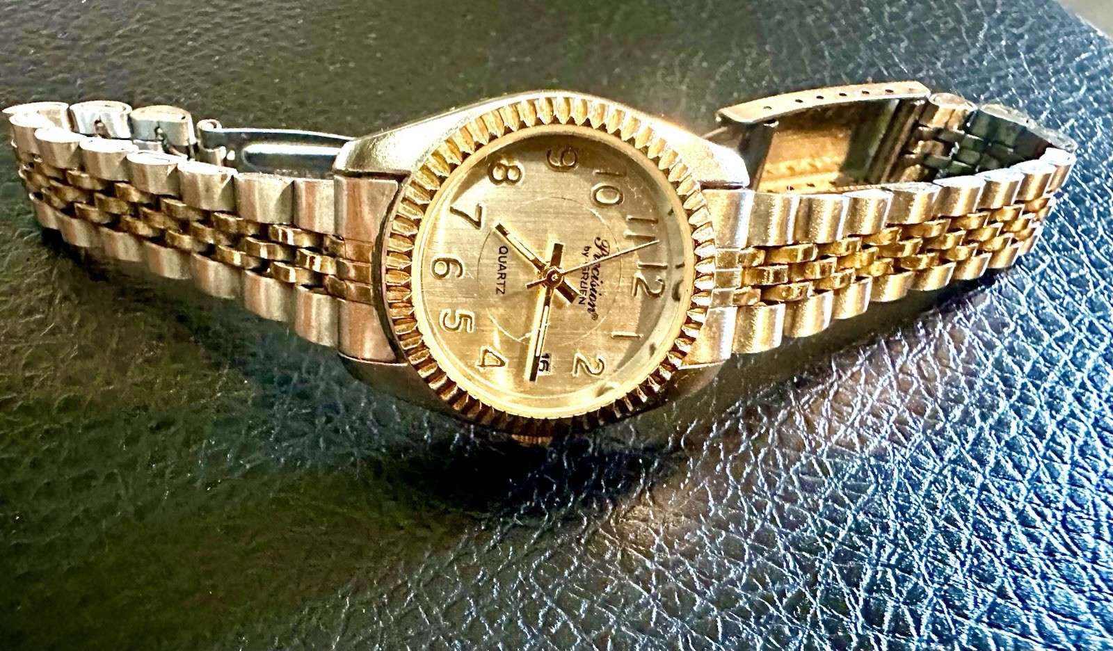 vintage Precision by Gruen quartz watch featuring a two-tone gold and silve