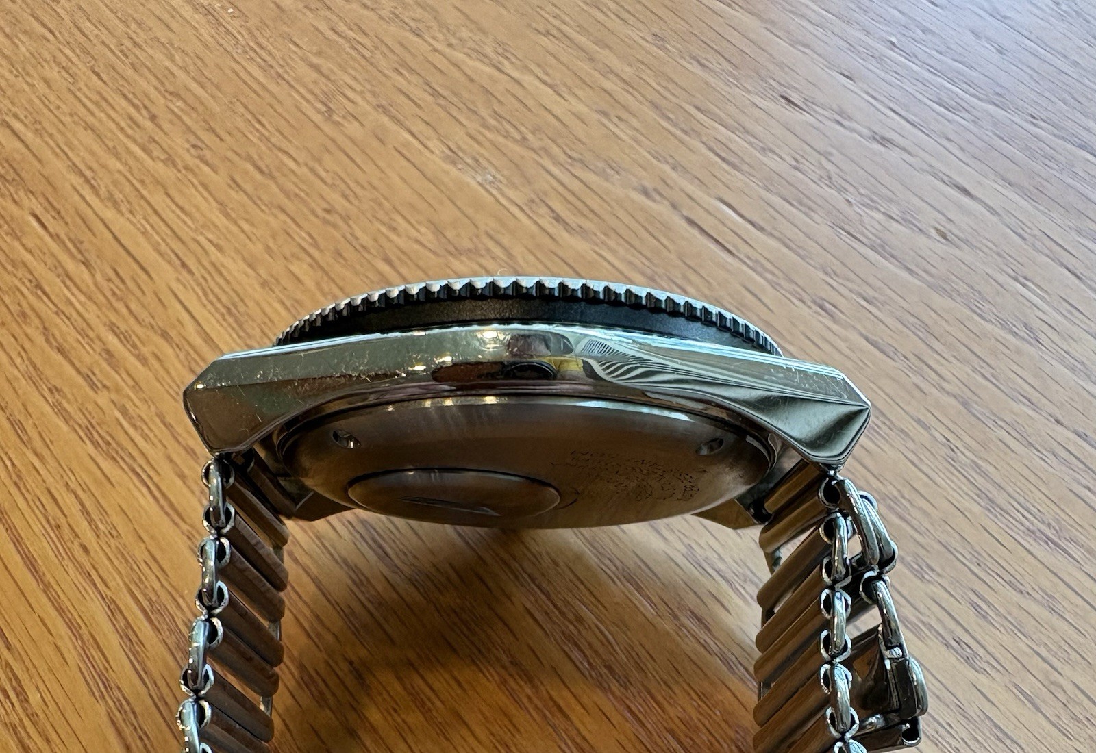 Timex Q Reissue, 12-hr dual-time bidirectional bezel, Bonklip-style bracelet.