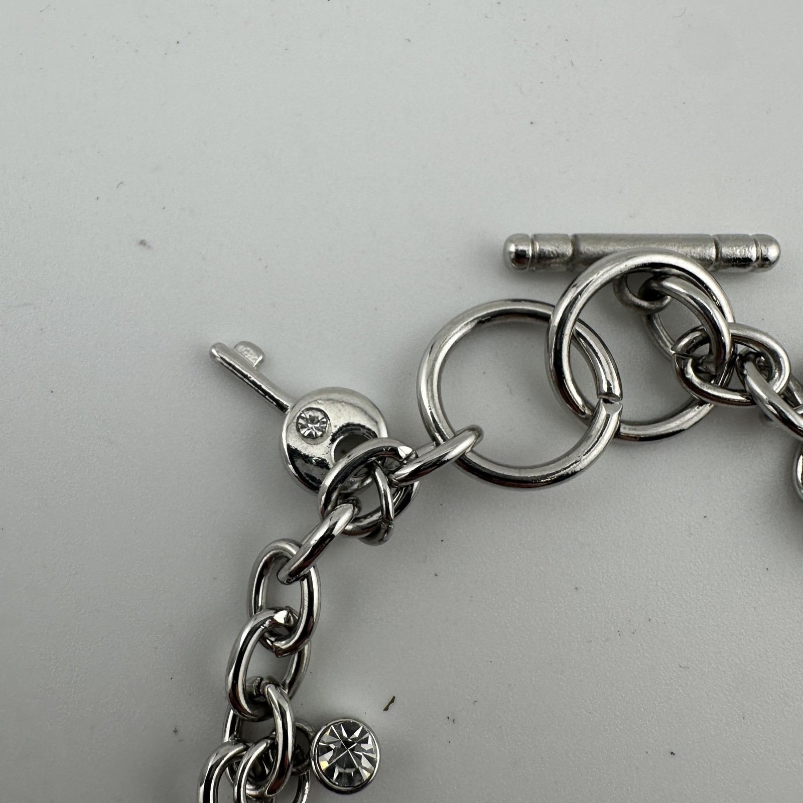 Charm Sz 8.7″ Bracelet Watch Womens White Dial Silver Tone Key Lock Ring Charms