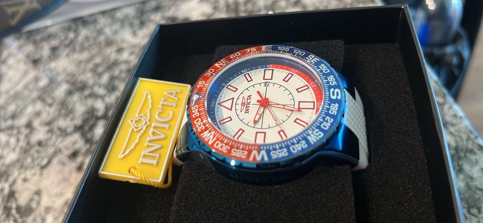 Invicta Aviator Men’s Quartz Wristwatch Blue/Red Compass Bezel White Strap