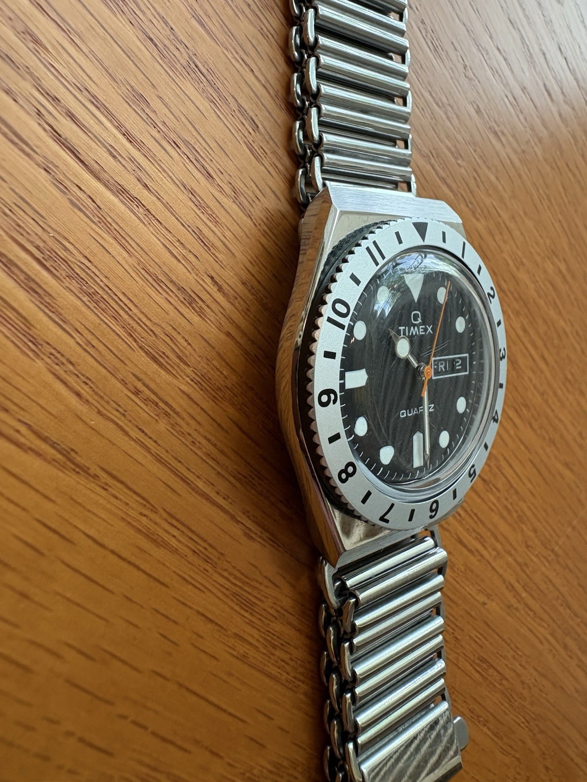Timex Q Reissue, 12-hr dual-time bidirectional bezel, Bonklip-style bracelet.