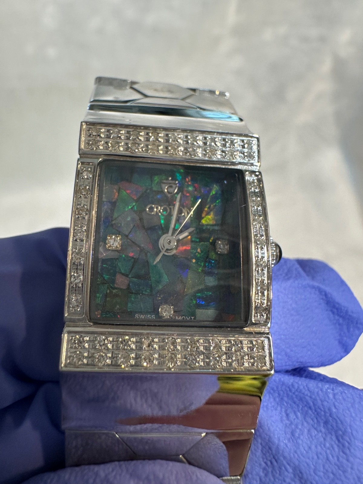 Women’s Croton mosaic opal dial and a diamond-encrusted bezel