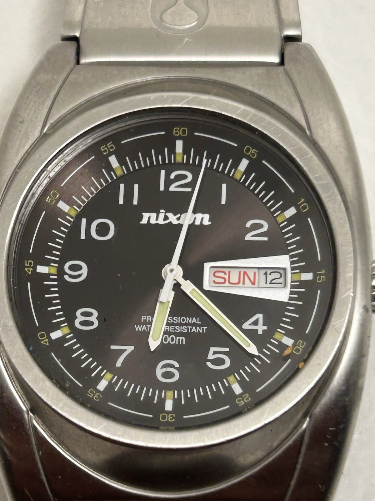 Nixon Quartz Wristwatch Black Dial Day/Date 100m Silver Stainless Bracelet