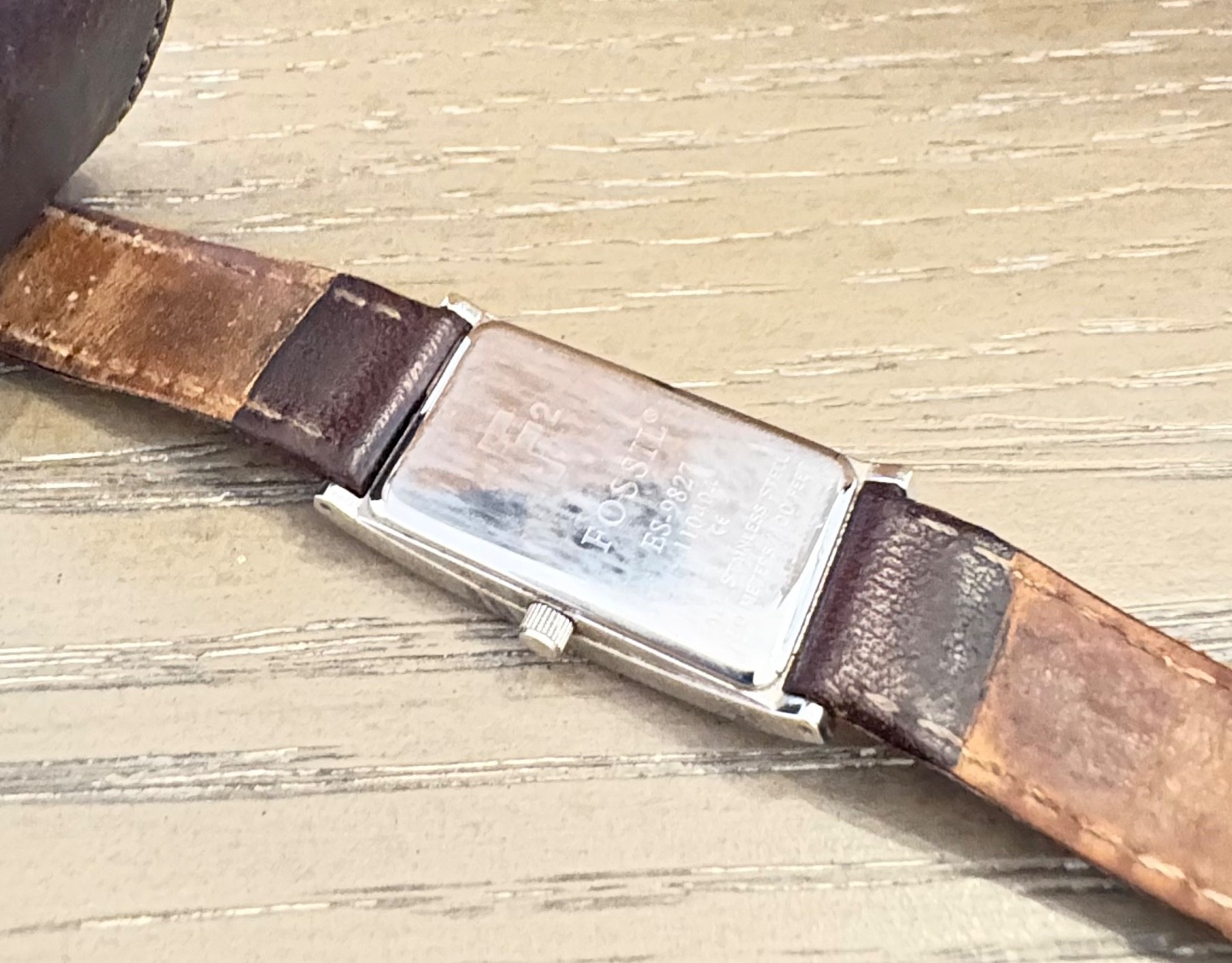 womens vintage fossil watch with silver rectangular face and brown leather strap